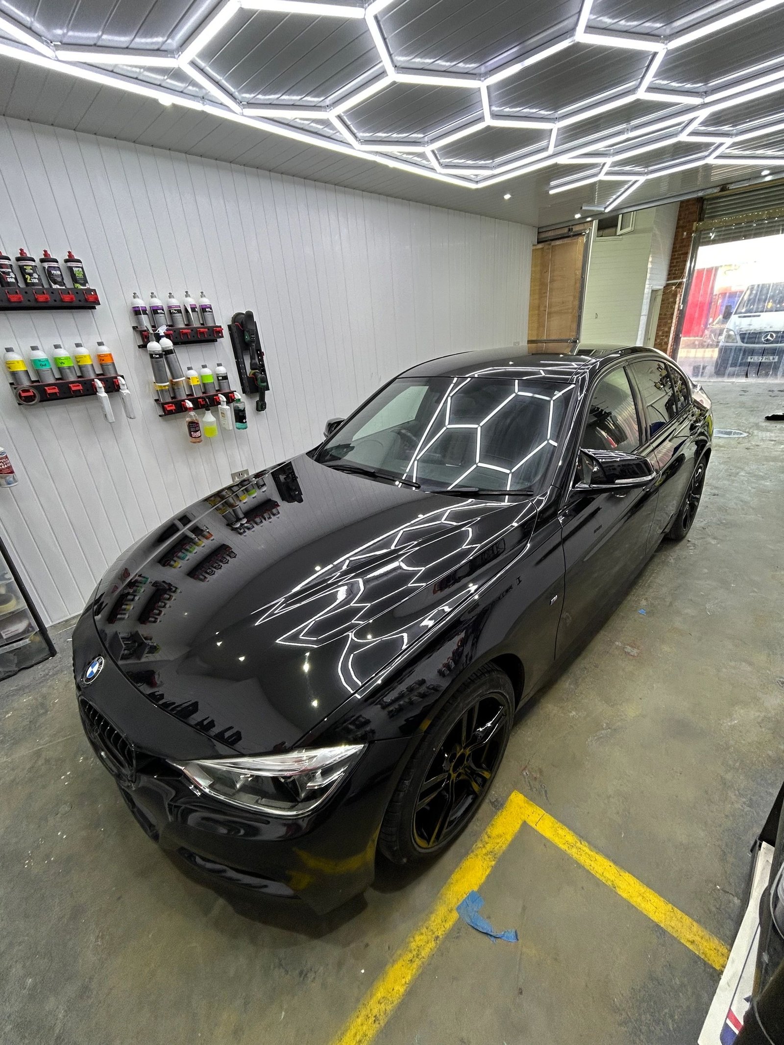 BMW in the Wicked detailing studio under geometric lighting